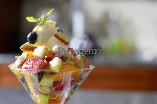 Festive fruit cocktail with mascarpone cheese in a martini glass