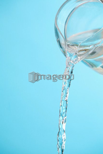 Stream of water being poured from a pitcher