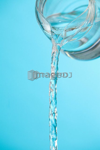 Stream of water being poured from a pitcher