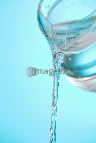 Stream of water being poured from a pitcher