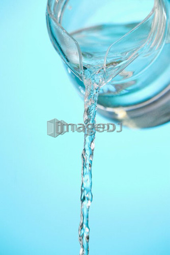 Stream of water being poured from a pitcher