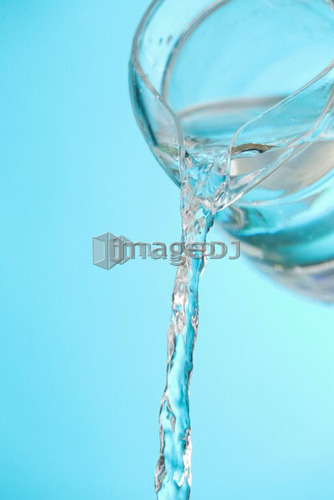 Stream of water being poured from a pitcher
