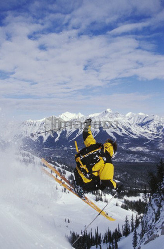 Young man catches air while telemarking at Fernie Alpine Resort, Fernie, British Columbia, Canada