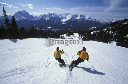 Young couple skiing at Lake Louise Resort, Alberta, Canada