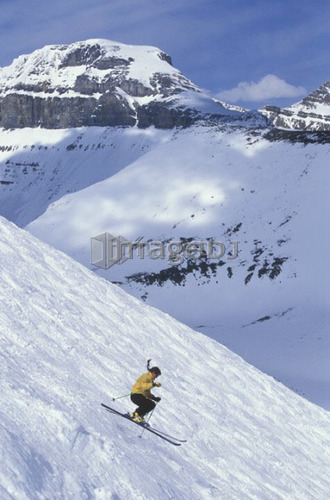 Young woman skiing in the bumps at Lake Louise Resort, Alberta, Canada.