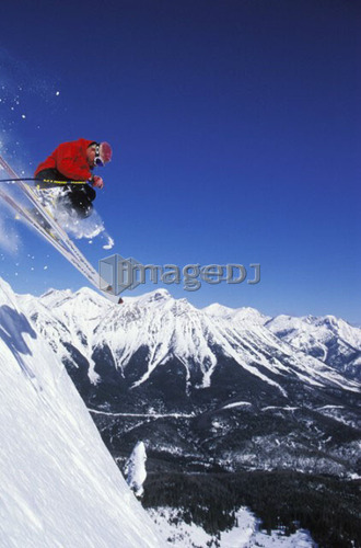 Young man catches air while skiing at Fernie Alpine Resort, Fernie, British Columbia, Canada.