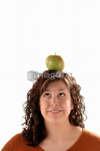Young girl w/apple on head, Regina, Saskatchewan