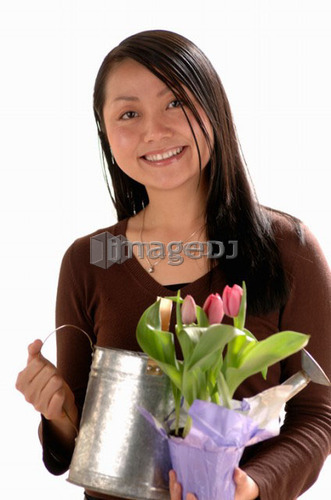 Asian Young girl w/watering can