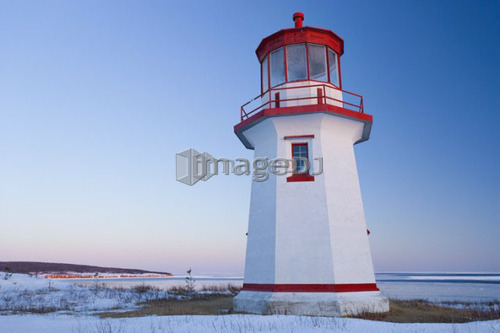View of Cap Blanc lighthouse and Île Bonaventure at sunset, Quebec