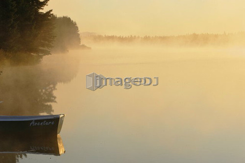 Boat and mist at Étang-à-la-Truite (Trout pond), Gaspesie, Quebec