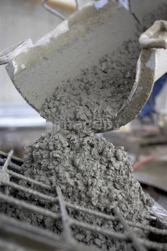 Cement pouring out of mixer; Canada, Ontario, Hamilton (Composting Facility)