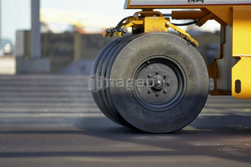 Wheels of paving roller on new asphalt; Canada, Ontario, Hamilton (Composting Facility)