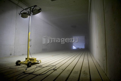 Metal halide light tower illuminating tunnel; Canada, Ontario, Hamilton (Composting Facility)