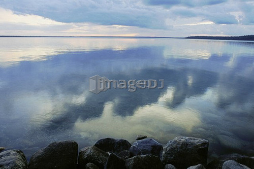 Reflection of clouds in Clear Lake; Canada, Manitoba, Riding Mountain National Park