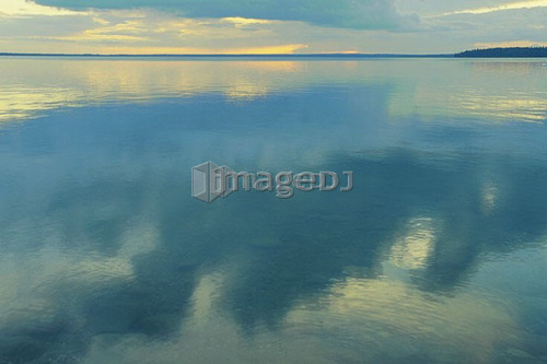 Reflection of clouds in Clear Lake; Canada, Manitoba, Riding Mountain National Park