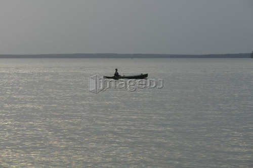 Canoe on lake, No motor boats allowed on Katherine L; Canada, Manitoba, Riding Mountain National Park