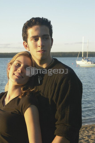 Teenage couple Clear Lake; Canada, Manitoba, Riding Mountain National Park