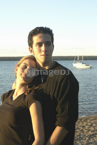 Teenage couple Clear Lake; Canada, Manitoba, Riding Mountain National Park
