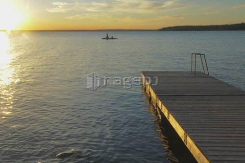45 year old woman Kayaking on Clear Lake; Canada, Manitoba, Riding Mountain National Park