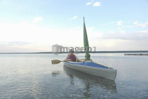 Woman in kayak Clear Lake Riding Mt. Nat. Park; Canada, Manitoba, Riding Mountain National Park