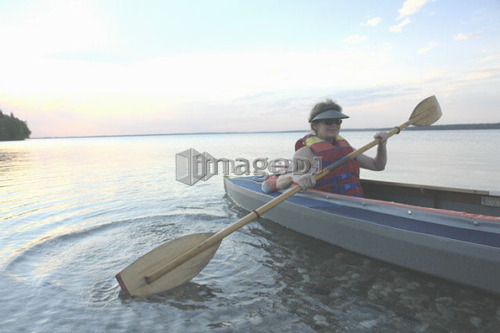Woman in kayak Clear Lake Riding Mt. Nat. Park; Canada, Manitoba, Riding Mountain National Park