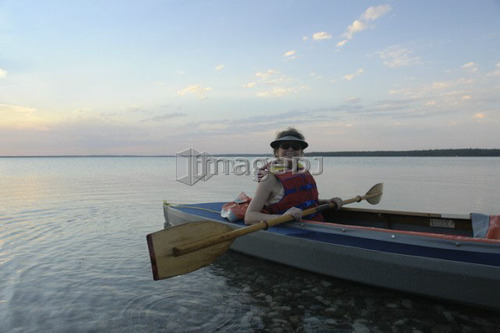Woman in kayak Clear Lake Riding Mt. Nat. Park; Canada, Manitoba, Riding Mountain National Park