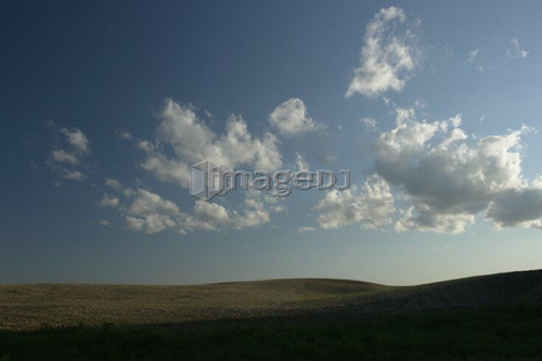 Evening sun over farmland; Canada, Manitoba, Erickson