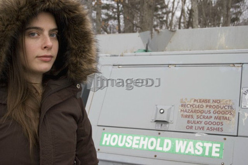 Woman recycling; Canada, Ontario