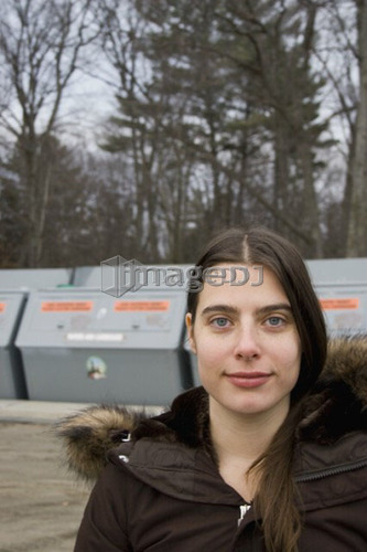 Woman recycling; Canada, Ontario