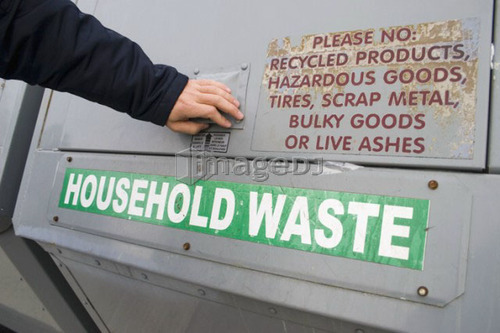 Woman recycling; Canada, Ontario