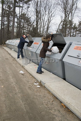 People at community recycling bins; Canada, Ontario