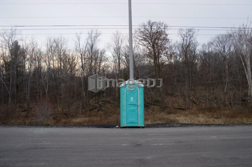 Portable lavoratory at side of highway; Canada, Ontario