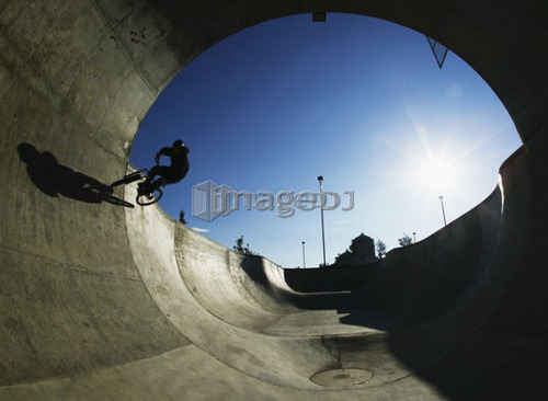 Mountain biker in concrete pipe, Calgary, Shaw Millenium Park