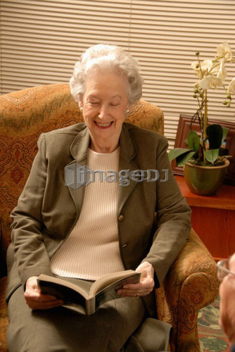 Senior Woman in Armchair; Canada, Saskatchewan, Regina