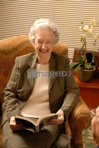 Senior Woman in Armchair; Canada, Saskatchewan, Regina