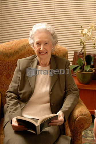 Senior Woman in Armchair; Canada, Saskatchewan, Regina