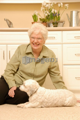 Senior Woman white dog; Canada, Saskatchewan, Regina