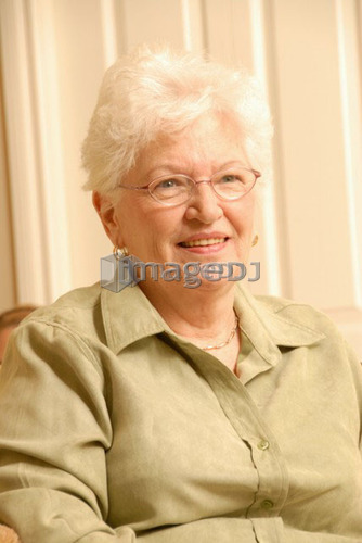 Senior Woman in chair; Canada, Saskatchewan, Regina
