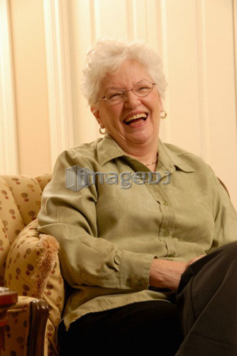 Senior Woman in chair; Canada, Saskatchewan, Regina