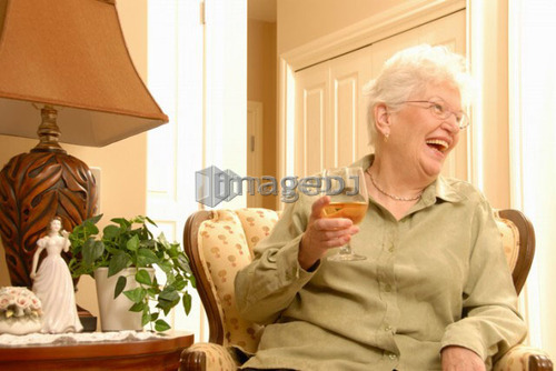 Senior Woman in chair; Canada, Saskatchewan, Regina