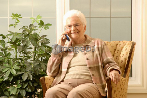 Senior Woman with cell phone; Canada, Saskatchewan, Regina