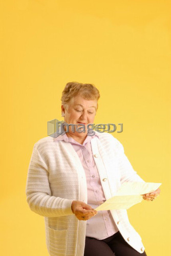 Senior Woman with letter; Canada, Saskatchewan, Regina
