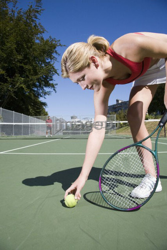 Woman readies to serve at tennis; Canada, British Columbia, Vancouver