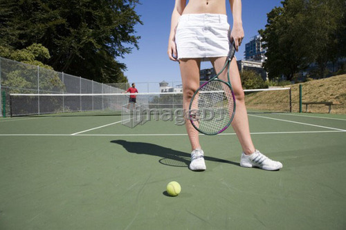 Couple on tennis court; Canada, British Columbia, Vancouver