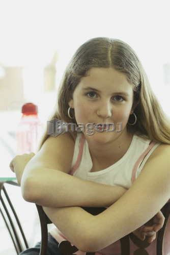 Portrait of pre-teen girl, wearing shirt made with hemp fibre, with reusable water bottle, Canada, Manitoba, Brandon