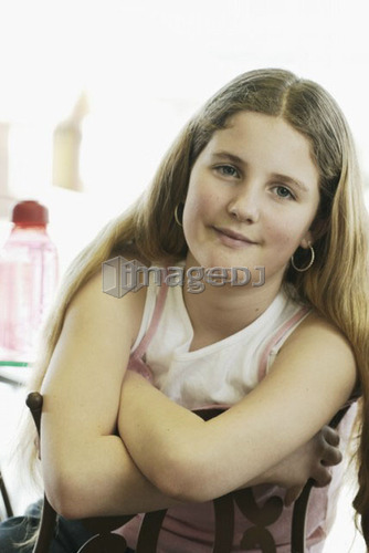 Portrait of pre-teen girl, wearing shirt made with hemp fibre, with reusable water bottle, Canada, Manitoba, Brandon