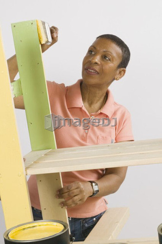 African American Woman Doing Home Improvement Painting, Canada, British Columbia
