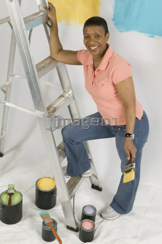 African American Woman Doing Home Improvement Painting, Canada, British Columbia