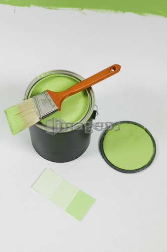 Open paint can, lid, colour swatch and brush, Canada, British Columbia
