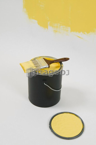 Open paint can, lid, colour swatch and brush, Canada, British Columbia